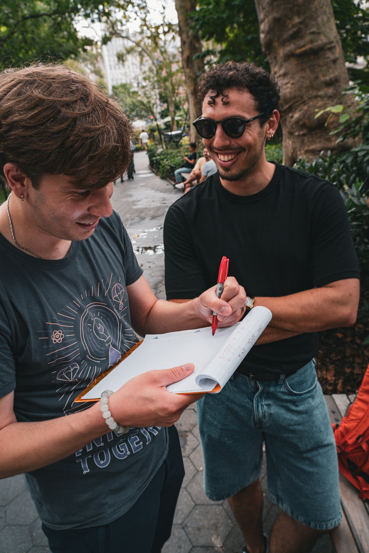 The final two participants laughing while writing one more instruction