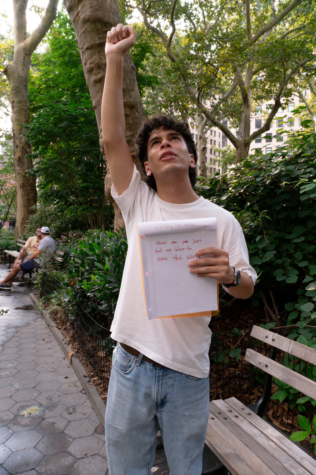 Second participant raising one fist while holding the inherited instruction